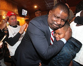 William D Lewis The Vindicator Tito Brown is all smiles as he hugs his son Quentin, 7, during victory party at MVR 11-7-2-17.