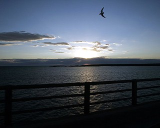 FILE - In a June 30, 2005 file photo, Michigan's Upper Peninsula and Lake Michigan is seen from the Mackinac Bridge in Mackinaw City, Mich. President Donald Trump wants to eliminate federal support of a program that addresses the Great Lakes' most pressing environmental threats. Trump's 2018 budget released Thursday, March 16, 2017, would remove all funding for the Great Lakes Restoration Initiative, which has received strong support from members of Congress in both parties since President Barack Obama established it in 2009. (AP Photo/Carlos Osorio, File)