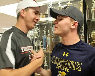 William D. Lewis The Vindicator Shaking hands during signing day at Boardman HS 11-8-17 are Kyle Kimerer,left, and Bryan Kordupel.