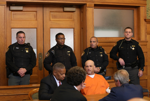 Nasser Hamad talks with his attorneys before learning the verdict in his aggravated murder trial, Wednesday, Nov. 8, 2017, at the Trumbull County Court House in Warren...(Nikos Frazier | The Vindicator)