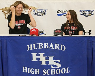 Adria Powell(left) and Claire Gagliardi sign their letters of intent for Ohio State University, Wednesday, Nov. 8, 2017, in the Hubbard High School Gymnasium in Hubbard. Gagliardi and Powell are both attending Ohio State University, playing gymnastics and volleyball respectively...(Nikos Frazier | The Vindicator)