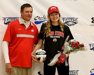 Adria Powell(right) and her father, Greg, pose for photos, Wednesday, Nov. 8, 2017, in the Hubbard High School Gymnasium in Hubbard. Powell plans on attending Ohio State University to play volleyball...(Nikos Frazier | The Vindicator)