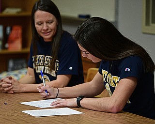 CORTLAND, OHIO - NOVEMBER 8, 2017: Annie Pavlansky signs her letter of intent to play basketball at Kent State University while sitting next to her mom, Kate, Wednesday morning at Lakeview High School. DAVID DERMER | THE VINDICATOR