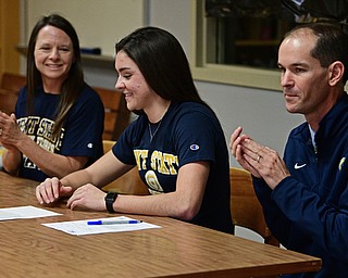 CORTLAND, OHIO - NOVEMBER 8, 2017: Annie Pavlansky smiles after signing her letter of intent while sitting next to her parents Tom, right, and Kate, Wednesday morning at Lakeview High School. DAVID DERMER | THE VINDICATOR