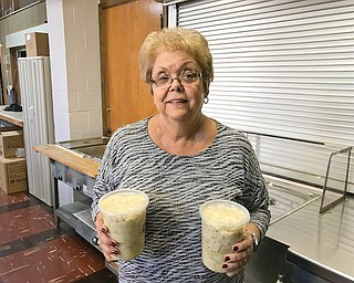 Mariann Pacak, a volunteer with St. John the Baptist Catholic Church Slovak Cultural Society, shows off cabbage and cottage cheese haluski. The next haluski sale will take place in December. Visit vindy.com to see video about the event.