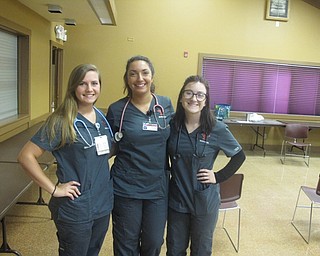 Neighbors | Zack Shively.Every Senior Fun Day offers blood pressure screenings. On Sept. 28, students from YSU's nursing program provided the blood pressure screenings. Pictured, from left, are Lindsey Laboy, Madison Mistovich and Stephanie Mayor.
