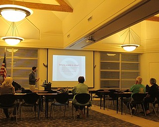Neighbors | Zack Shively.Public Information Officer Leka Papalko with the Public Utilites Commission of Ohio gave a presentation at the Austintown library on Oct. 11. He helped residents figure out how to find the electric and gas plans that would be most beneficial to them.
