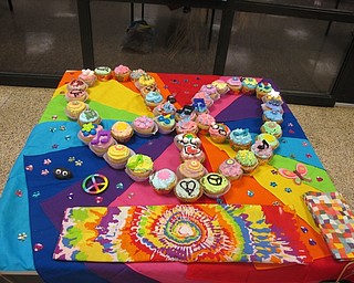 Neighbors | Zack Shively.The Boardman marching band had a "Cupcake Wars" competition during their "In Concert" event. Participating students split into 14 teams and designed cupcakes under a Woodstock theme. The students were judged based on the taste of their cupcakes and the presentation of their full group of cupcakes. After the event, the atttendees walked over to the cafeteria to eat the cupcakes.