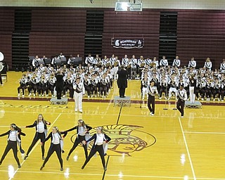 Neighbors | Zack Shively.While the marching band sat during their "In Concert" event, the Spartan Silks/Twirlers and Spartan Sweethearts did flag and dance routines throughout the show for the crowd. Pictured, the Sweethearts dance to the Boardman band's playing of a Hamilton Melody including the songs "My Shot" and "The Room Where It Happens" from the Broadway musical.
