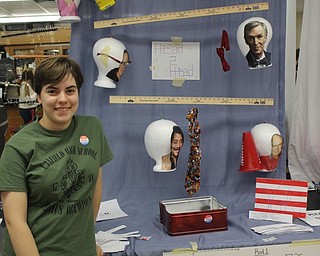 Neighbors | Abby Slanker.Canfield High School senior physics student Smaranda Solomon displayed her Head to Head mobile featuring ‘heads’ of scientists during the school’s annual Mobile Mania on Nov. 2.