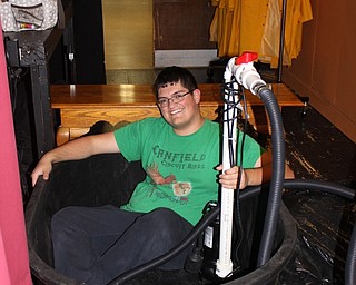 Neighbors | Abby Slanker.Canfield High School senior, and “Singin’ in the Rain” cast member, Elijah Mt. Castle created a rapid water displacement system to enable rain to fall during the Canfield Players Drama Club’s musical.