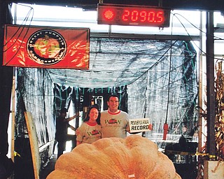 Above are Dave and Carol Stelts of Enon Valley, Pa., with their giant pumpkin. The pumpkin set the record for Pennsylvania at the Ohio Valley Giant Pumpkin Growers’ recent competition.