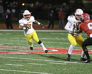   ROBERT K YOSAY  | THE VINDICATOR..CM #2 Chris Gruber gets ready to rumble 80 Yard for a TD as CM#12 John Murphy Blocks SBR #6 DaJuan Jones.Cardinal Mooney vs Steubenville Big Red at Salem Stadium...-30-