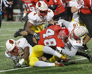   ROBERT K YOSAY  | THE VINDICATOR..Gang Tackle SBR #48Jonathon Blackmon  get stopped by  CM#5 Nico Marchionda  #4 Darrion Fant and 18  Luke Fulton for no gain..Cardinal Mooney vs Steubenville Big Red at Salem Stadium...-30-