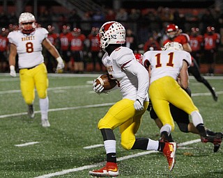   ROBERT K YOSAY  | THE VINDICATOR..CM #5  Nico Marchionda looks up field after intercepting a pass in the first quarter. .CM #11 Brent Weaver throwing a block and  #8CM  Brennan Olesh looks on..Cardinal Mooney vs Steubenville Big Red at Salem Stadium...-30-