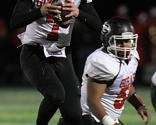 he Vindicator  Girard's Mark Waid(7) jumps while looking for a receiver during 1rst half action at Twinsburg.