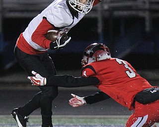 he Vindicator  Girard's Mark Waid(7) eludes Perry's Eric Somogyl (3)during 1rst half action at Twinsburg.