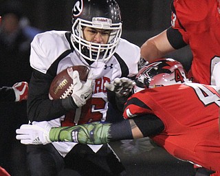 he Vindicator  Girard'sMorgan Clardy(16) eludes Perry's Cody Baranauskas(44) during 1rst half action at Twinsburg.