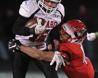 he Vindicator  Girard's Morgan Clardy(16) eludes Perry's Cameron rogers(46)) during 1rst half action at Twinsburg.