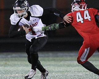 Willioam D. Leiws The Vindicator  Girard's Mark Waid(7) eludes Perry's Cody Baranauskas(44) during 1rst half action at Twinsburg.