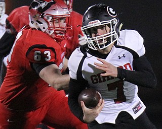 William D. Lewis The Vindicator  Girard's Mark Waid(7) eludes Perry's Nick Mson(63)) during 1rst half action at Twinsburg.