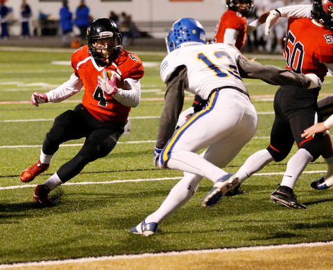 WARREN, OHIO - NOVEMBER 10, 2017:  Canfield's Paul Breinz (4) makes a cut to score a 3 yard TD during the 1st qtr. at Harding High School, Mollenkopf Stadium.  MICHAEL G TAYLOR | THE VINDICATOR