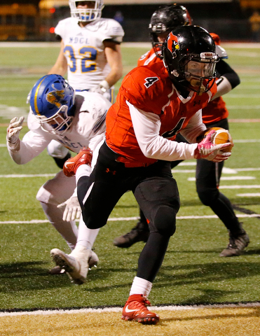 WARREN, OHIO - NOVEMBER 10, 2017:   Canfield's Paul Breinz (4) scores a 5 yard TD during the 4th qtr. at Harding High School, Mollenkopf Stadium.  MICHAEL G TAYLOR | THE VINDICATOR