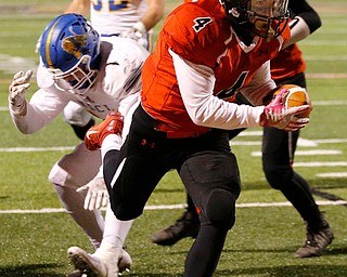 WARREN, OHIO - NOVEMBER 10, 2017:   Canfield's Paul Breinz (4) scores a 5 yard TD during the 4th qtr. at Harding High School, Mollenkopf Stadium.  MICHAEL G TAYLOR | THE VINDICATOR