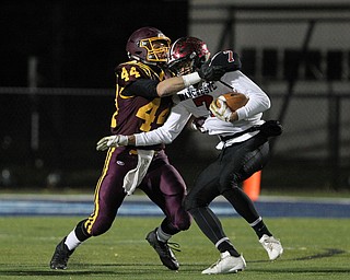 Peyton Remish (44) of South Range wraps up Ethan Wright (7) of Manchester during the first half of Friday nights matchup at Louisville High School in Louisville.  Dustin Livesay  |  The Vindicator  11/10/17  Louisville.