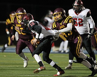 South Range'sRyan Davenport (45) swings down Manchesters Jo Jo France (10) during the first half of Friday nights matchup at Louisville High School in Louisville.  Dustin Livesay  |  The Vindicator  11/10/17  Louisville.