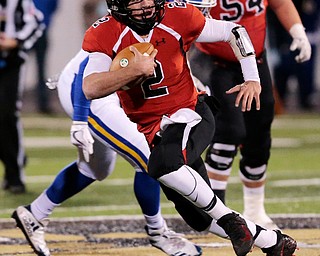 WARREN, OHIO - NOVEMBER 10, 2017: Canfield's Vinny Fiorenza (2) gains 17 yards on 3rd to pickup a 1st down during the 1st qtr. at Harding High School, Mollenkopf Stadium. MICHAEL G TAYLOR | THE VINDICATOR