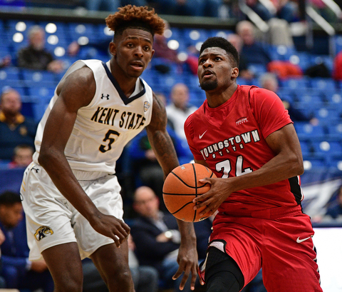 AKRON, OHIO - NOVEMBER 11, 2017: Youngstown State's Cameron Morse drives on Kent State's Danny Pippen during the first half of their game Saturday night at James A. Rhodes Arena. DAVID DERMER | THE VINDICATOR