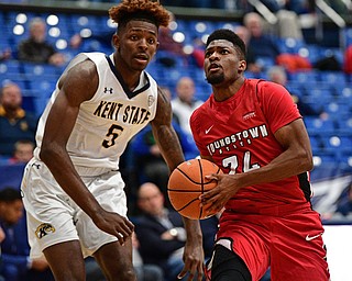 AKRON, OHIO - NOVEMBER 11, 2017: Youngstown State's Cameron Morse drives on Kent State's Danny Pippen during the first half of their game Saturday night at James A. Rhodes Arena. DAVID DERMER | THE VINDICATOR