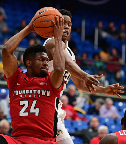 AKRON, OHIO - NOVEMBER 11, 2017: Youngstown State's Cameron Morse grabs a rebound away from Kent State's Kevin Zabo during the first half of their game Saturday night at James A. Rhodes Arena. DAVID DERMER | THE VINDICATOR