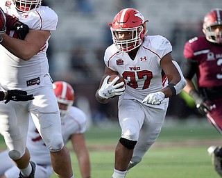 Youngstown State running back Tevin McCaster (37) looks for running room in the third quarter against Southern Illinois at Saluki Stadium on Saturday.