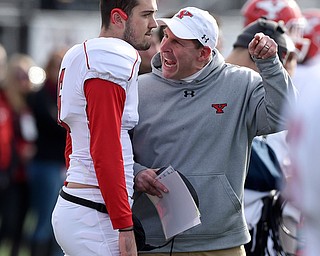 Youngstown State head coach Bo Pelini gives Youngstown quarterback Hunter Wells (6) an earful in the first quarter against Southern Illinois at Saluki Stadium on Saturday.