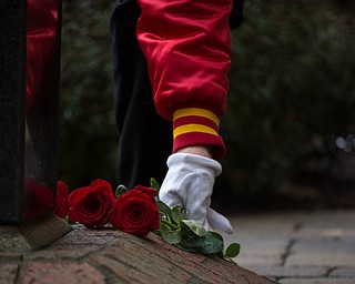Rebecca Devereaux | The Vindicator ..A veteran places a rose on the vietnam memorial in memory of each soldier in Mahonny County fallen while serving in the Vietnam War.