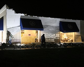 Workers begin repairs on the damage after a storm hit the Mahoning Valley, Sunday, Nov. 5, 2017, at the Ethan Allen Furniture Store in Boardman...(Nikos Frazier | The Vindicator)