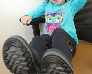 ROBERT K YOSAY | THE VINDICATOR..Wed morning Making Kids Count was at the austintown elementary giving out boots..Layla Yousko.. kindergarten.. shows offer new boots courtesy of MKC..This year, Making Kids Count is handing out 404 pairs of boots and winter socks to students in Mahoning and Trumbull counties. .-30-