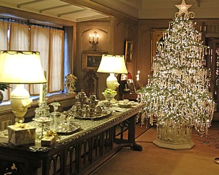 ROBERT K YOSAY | THE VINDICATOR..The Arms Family Museum in Youngstown Ohio is sparkling for the holiday season! Memories of Christmas Past, the annual holiday spectacular, is in its tenth year in the 1905 Arts & Crafts mansion of Olive and Wilford Arms, and the home of the Mahoning Valley Historical Society. The seven period rooms of the Arms Family home are filled to the brim with rare, one-of-a-kind, vintage decorations that include ornaments, lighting, trees, and toys. This display features many pieces from the Historical SocietyÕs collection as well as items on loan from private collectors..-30-
