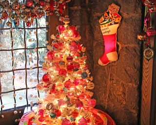 ROBERT K YOSAY | THE VINDICATOR..The Arms Family Museum in Youngstown Ohio is sparkling for the holiday season! Memories of Christmas Past, the annual holiday spectacular, is in its tenth year in the 1905 Arts & Crafts mansion of Olive and Wilford Arms, and the home of the Mahoning Valley Historical Society. The seven period rooms of the Arms Family home are filled to the brim with rare, one-of-a-kind, vintage decorations that include ornaments, lighting, trees, and toys. This display features many pieces from the Historical SocietyÕs collection as well as items on loan from private collectors..-30-