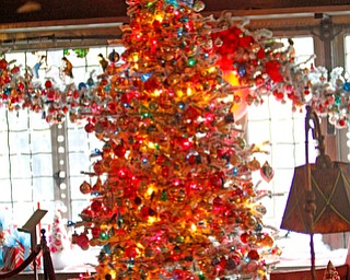 ROBERT K YOSAY | THE VINDICATOR..The Arms Family Museum in Youngstown Ohio is sparkling for the holiday season! Memories of Christmas Past, the annual holiday spectacular, is in its tenth year in the 1905 Arts & Crafts mansion of Olive and Wilford Arms, and the home of the Mahoning Valley Historical Society. The seven period rooms of the Arms Family home are filled to the brim with rare, one-of-a-kind, vintage decorations that include ornaments, lighting, trees, and toys. This display features many pieces from the Historical SocietyÕs collection as well as items on loan from private collectors..-30-