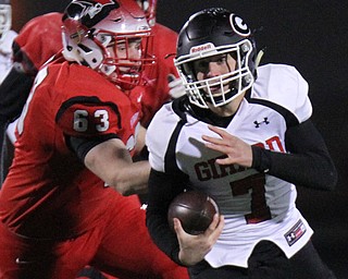 William D. Lewis The Vindicator Girard's Mark Waid(7) eludes Perry's Nick Mson(63)) during 1rst half action at Twinsburg.