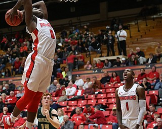 Youngstown State forward Tyree Robinson (0) dunks the ball as Youngstown State guard Braun Hartfield (1) cheers him on during the first half of a NCAA College Basketball game, Tuesday, Nov. 14, 2017, at Beeghly Center in Youngstown. Youngstown State won 134-46...(Nikos Frazier | The Vindicator)..