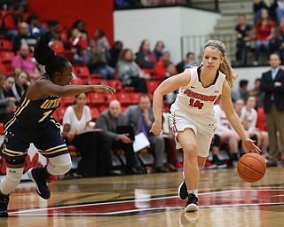 Youngstown State guard Melinda Trimmer (14) drives towards the net against Kent State guard Naddiyah Cross (1) during the first quarter of a NCAA College Basketball game, Tuesday, Nov. 14, 2017, at Beeghly Center in Youngstown. Kent State won 55-44...(Nikos Frazier | The Vindicator)..