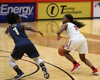 Youngstown State guard Indiya Benjamin (3) drives against Kent State guard Naddiyah Cross (1) during the fourth quarter of a NCAA College Basketball game, Tuesday, Nov. 14, 2017, at Beeghly Center in Youngstown. Kent State won 55-44...(Nikos Frazier | The Vindicator)..