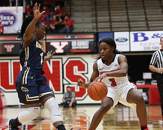 Youngstown State guard Indiya Benjamin (3) jumps backwards as Kent State guard Naddiyah Cross (1) pressures during the fourth quarter of a NCAA College Basketball game, Tuesday, Nov. 14, 2017, at Beeghly Center in Youngstown. Kent State won 55-44...(Nikos Frazier | The Vindicator)..