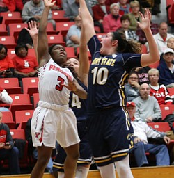 Youngstown State guard Indiya Benjamin (3) goes up for a layup against Kent State forward McKenna Stephens (10) during the fourth quarter of a NCAA College Basketball game, Tuesday, Nov. 14, 2017, at Beeghly Center in Youngstown. Kent State won 55-44...(Nikos Frazier | The Vindicator)..