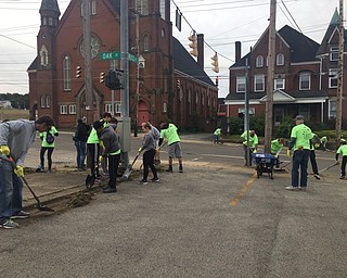 Neighbors | Submitted.Boardman High School's Emerging Leaders group scraped sidewalks in Youngstown in an effort to clean up the city and "fight blight" on Sept. 1
