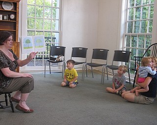 Neighbors | Zack Shively.Librarian Amanda Koller read "Fall is Not Easy" by Marty Kelley to childen and parents at Poland Library on Sept. 25 as a part of their Listen and Create program.